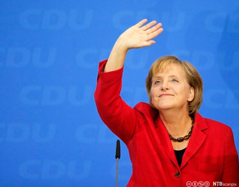 Angela Merkel, German Chancellor and leader of the conservative Christian Democratic Union party (CDU) waves to her supporters after first exit polls in the German general election (Bundestagswahl) at party headquarters in Berlin